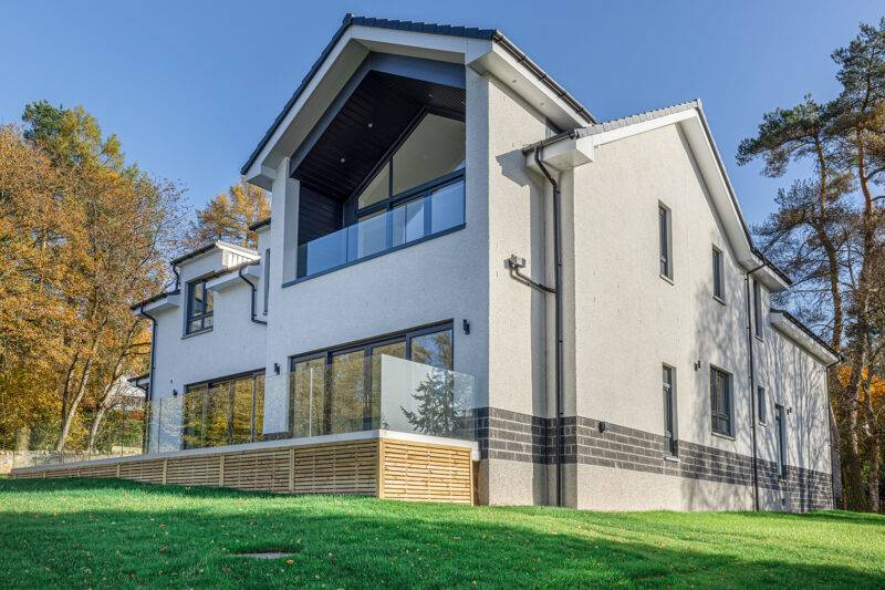 White house with decking and garden